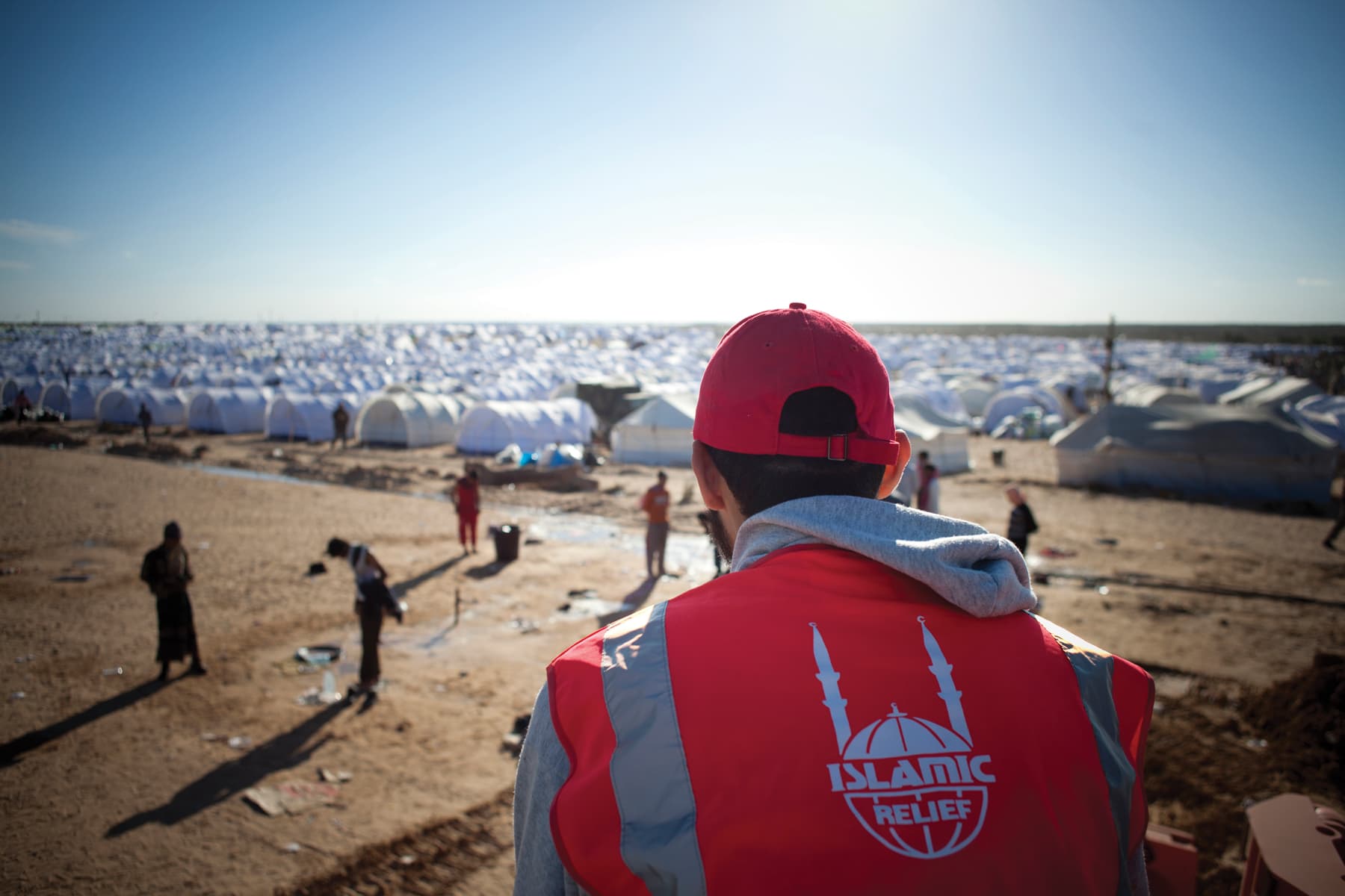 Residents pass time at Choucha refugee camp in Ra’s Ajdir, Tunisia. Many people arrived at the camp after fleeing crisis in neighbouring Libya. Tunisia, 2011.