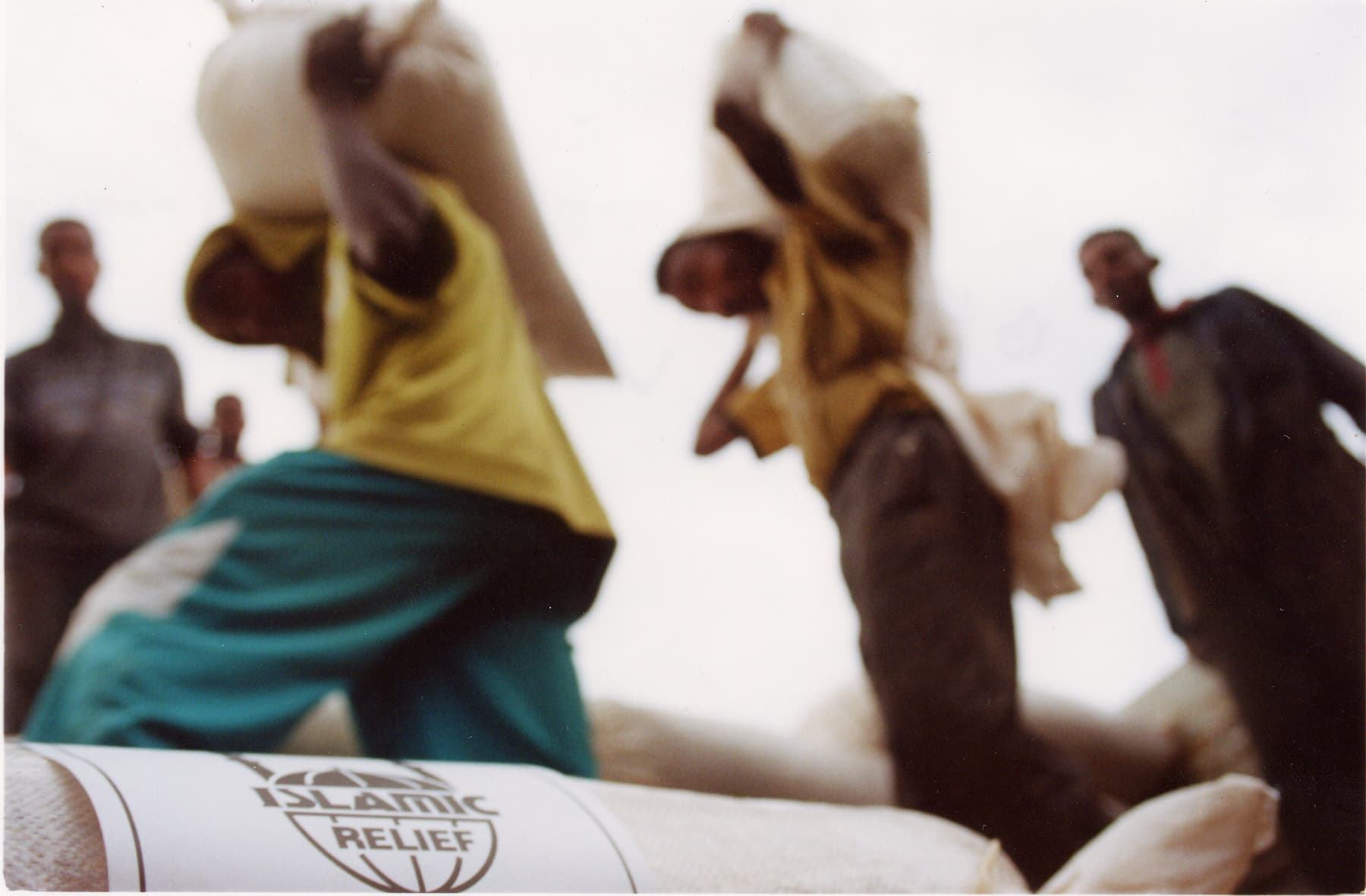 Men carrying food supplies in sacks for distribution. Islamic Relief providing emergency relief. Ethiopia, 2011.