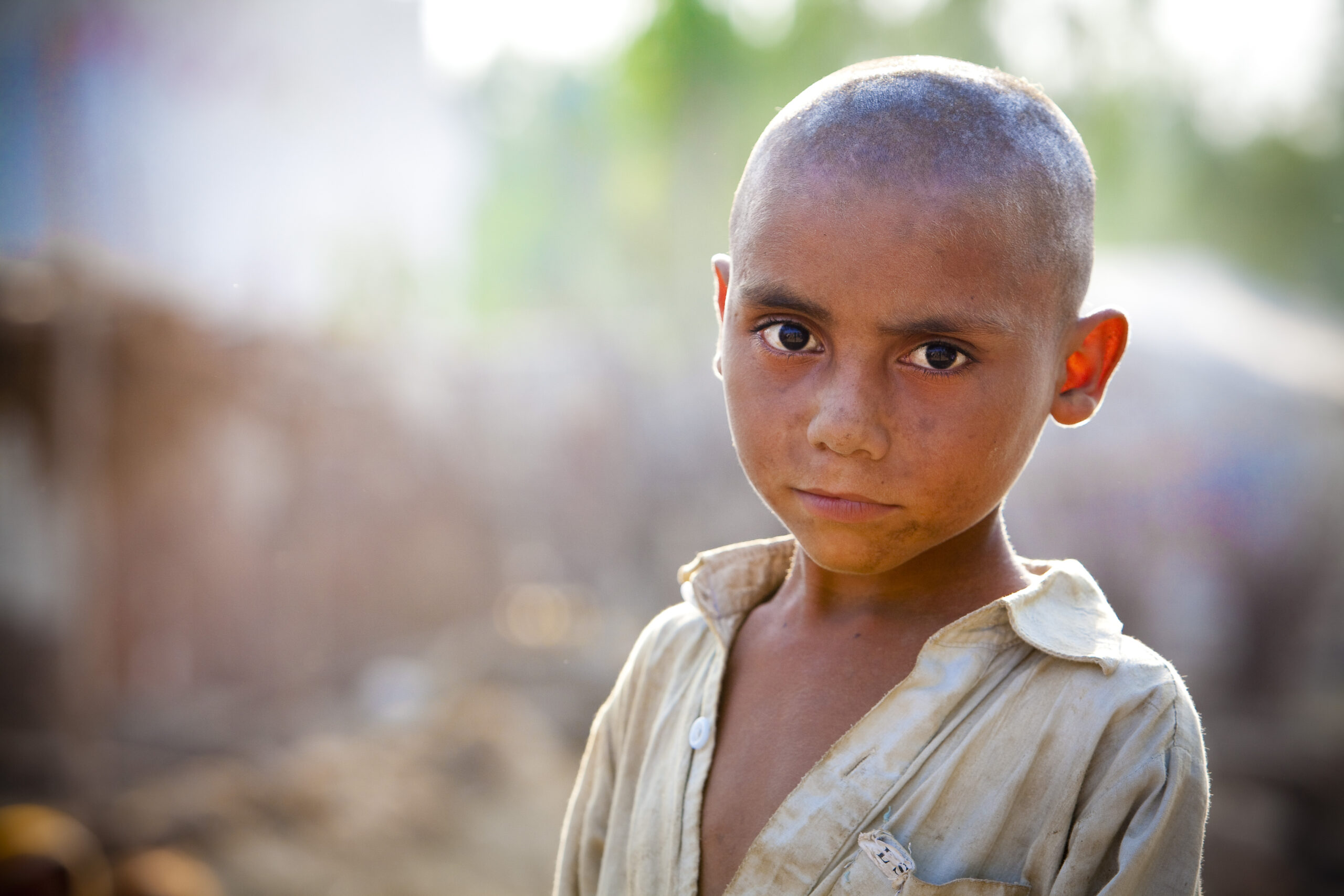 A young boy affected by devastating flooding in Pakistan. Pakistan, 2010.
