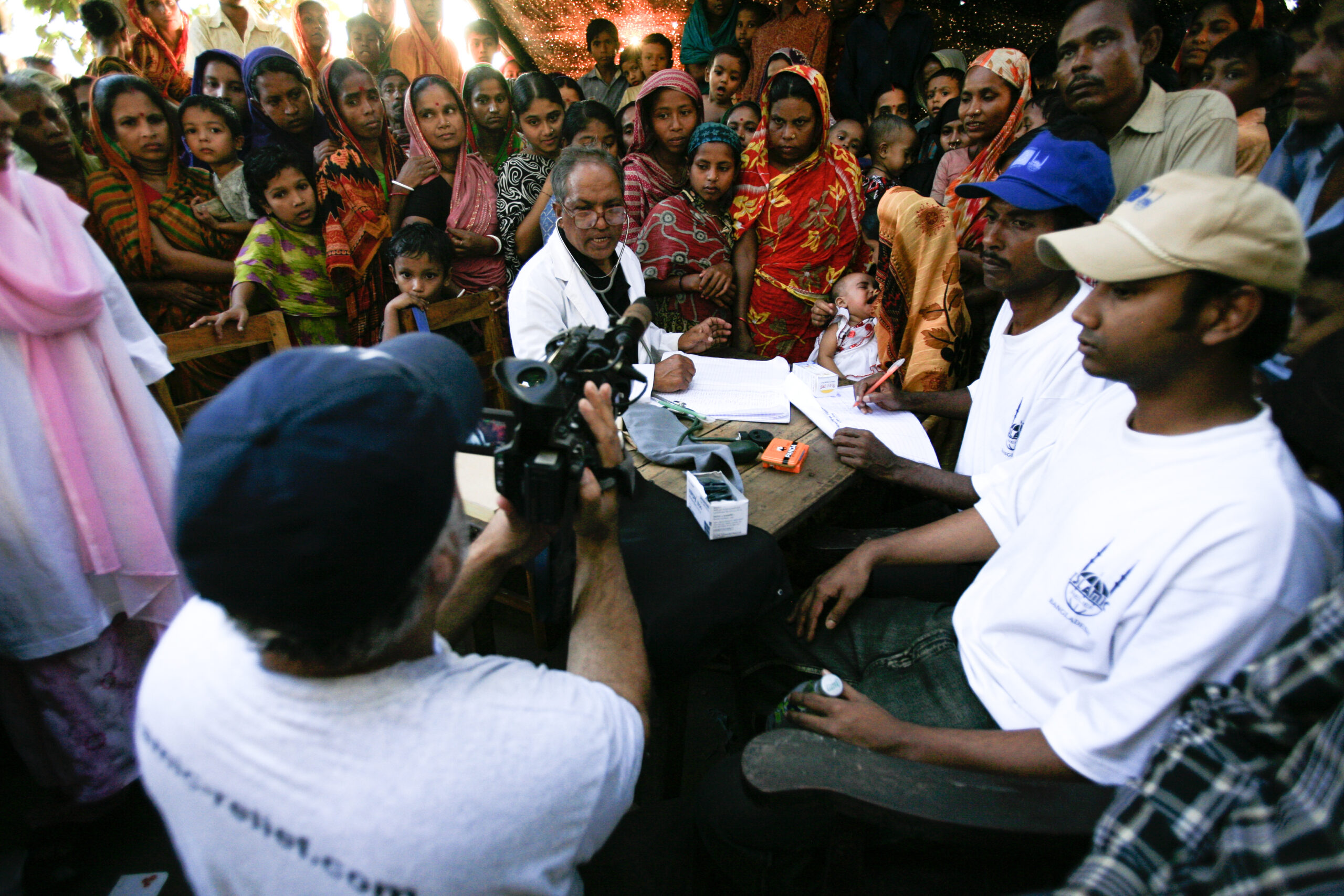 Islamic Relief staff assist people affected by Cyclone Sidr - one of the worst natural disasters to hit Bangladesh. Bangladesh, 2007.