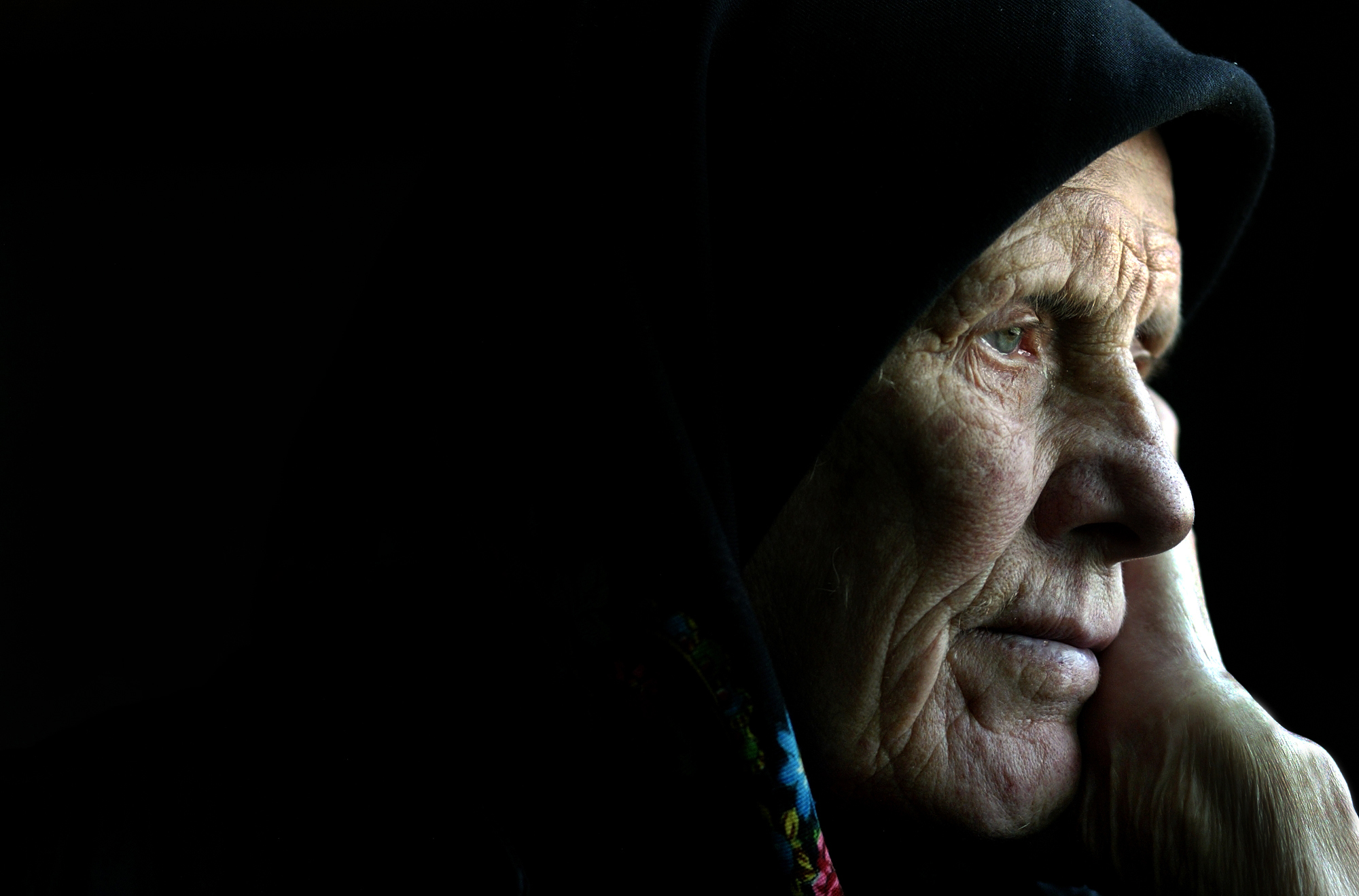 Close up of an older Bosnian woman. Photo taken by renowned photo journalist Wendell Phillips. Bosnia and Herzegovina, 2004 