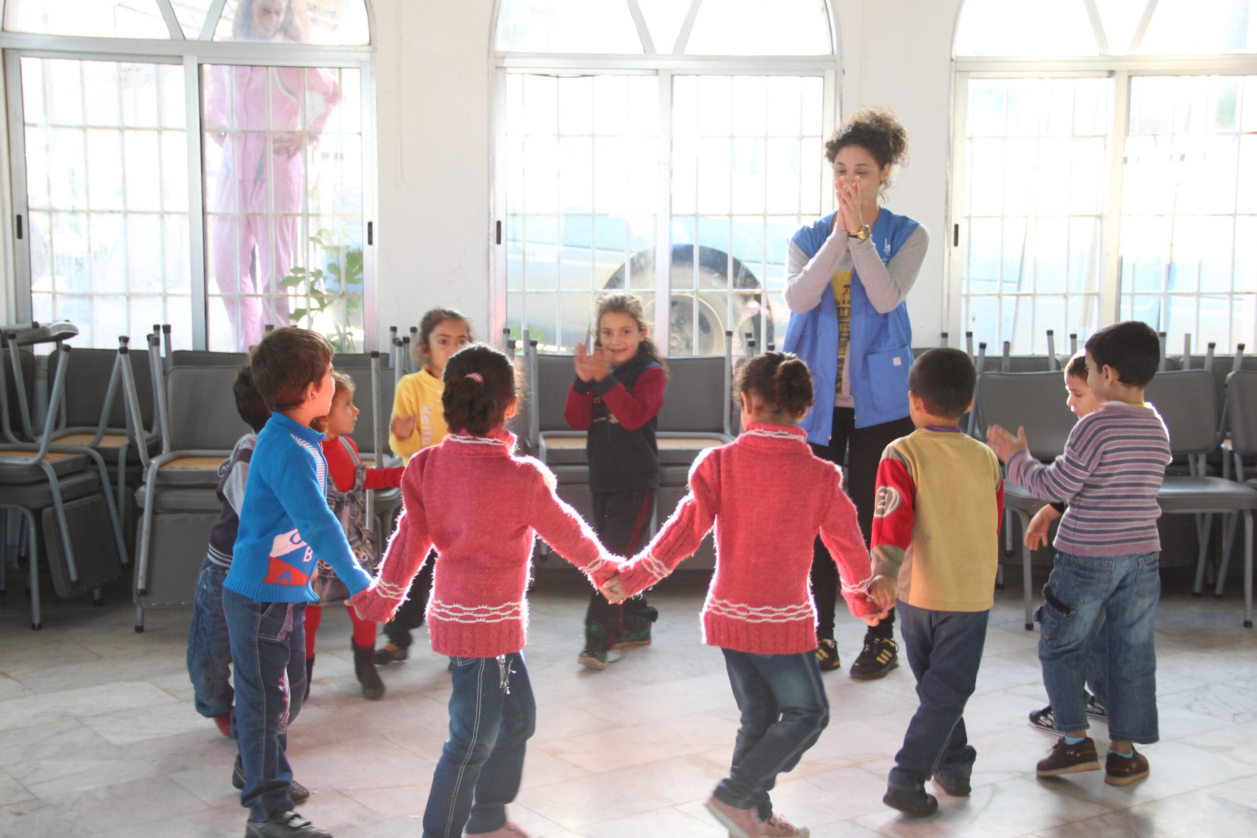 Children play during activities held to improve their wellbeing. Lebanon, 2014.