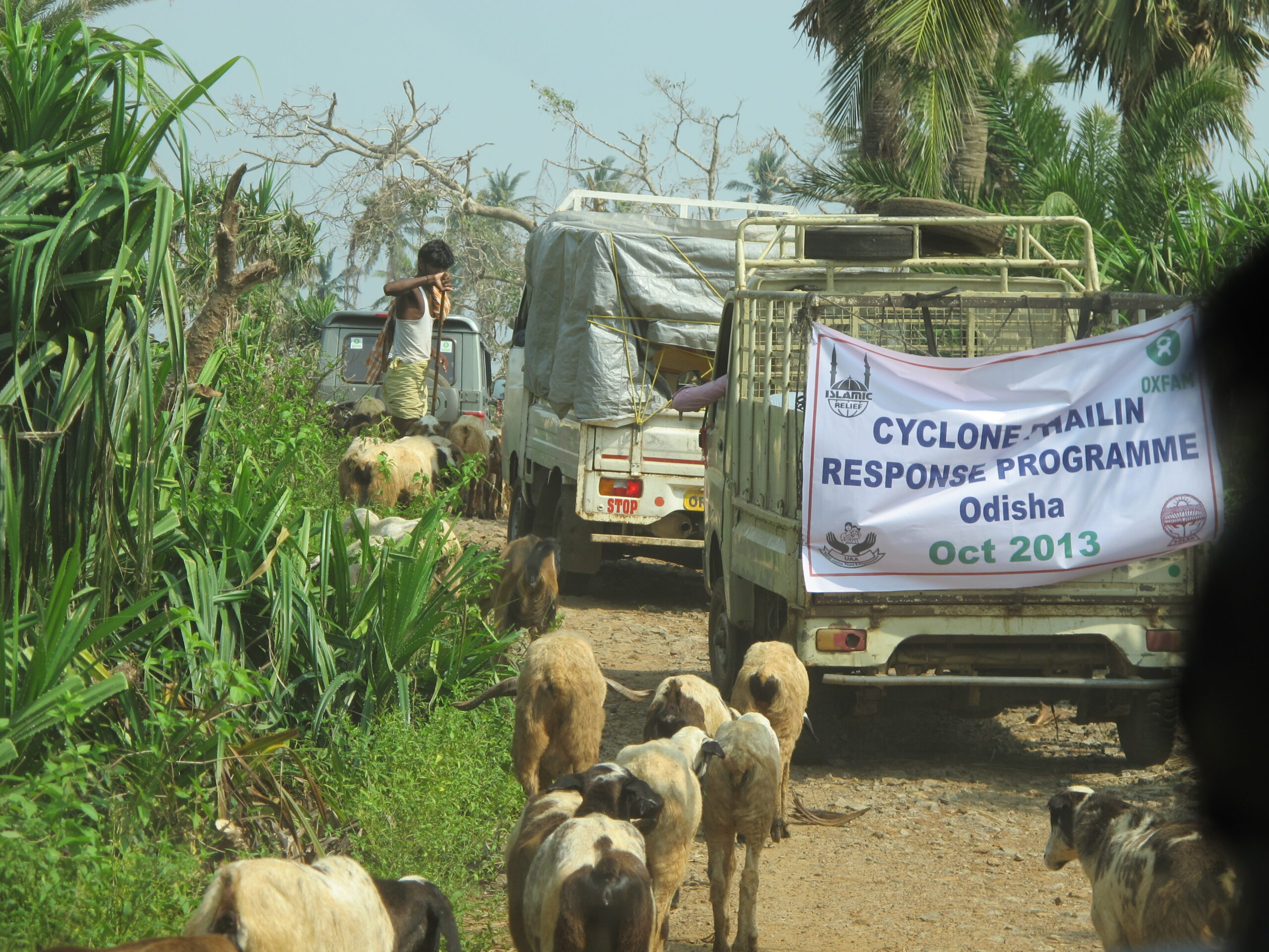 A convoy delivers aid in Kamapalli Village in India’s Odisha State following Cyclone Phailin. India, 2013.