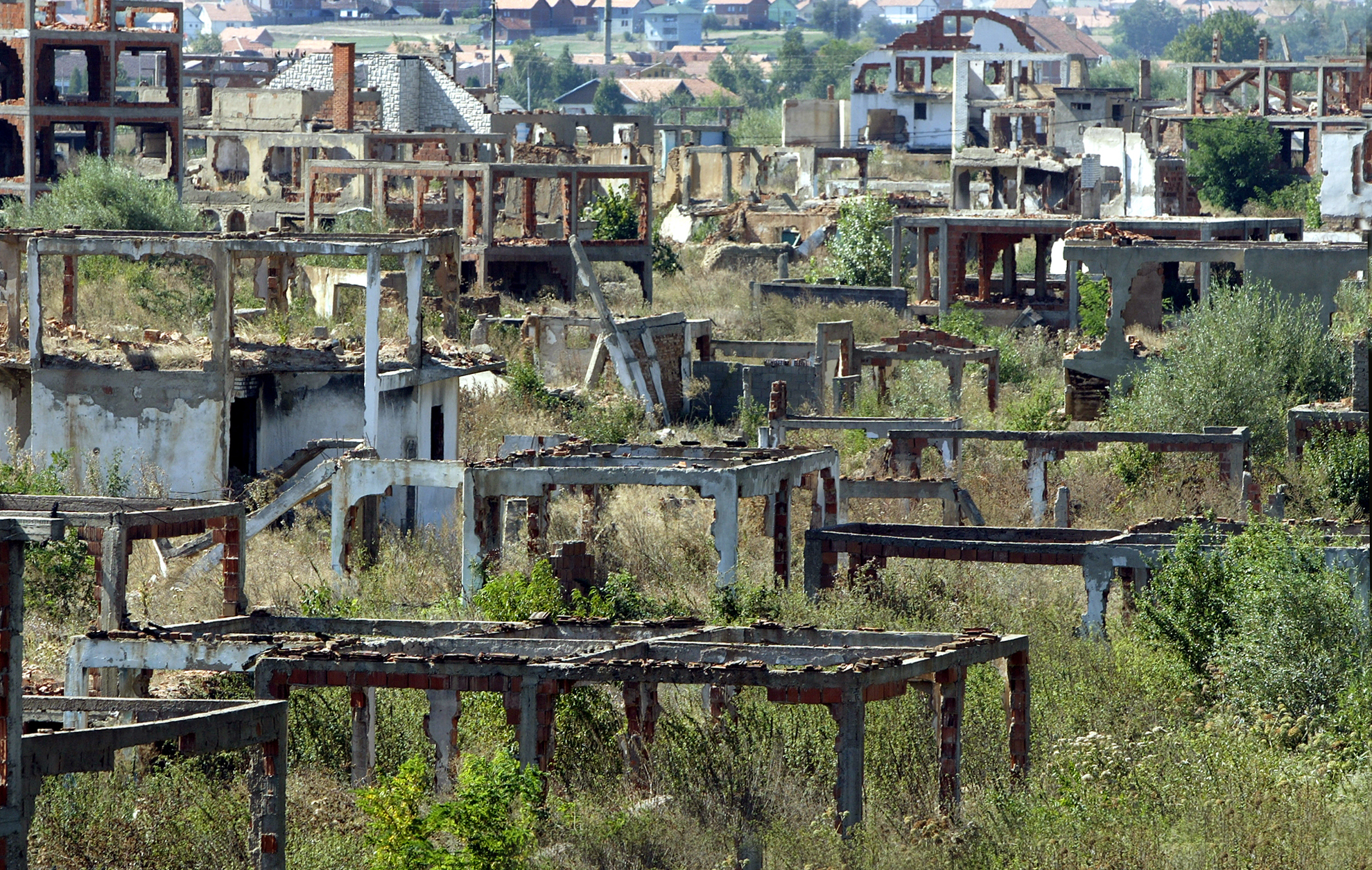 Shells of destroyed buildings remain standing following the war. Bosnia and Herzegovina, 2004.
