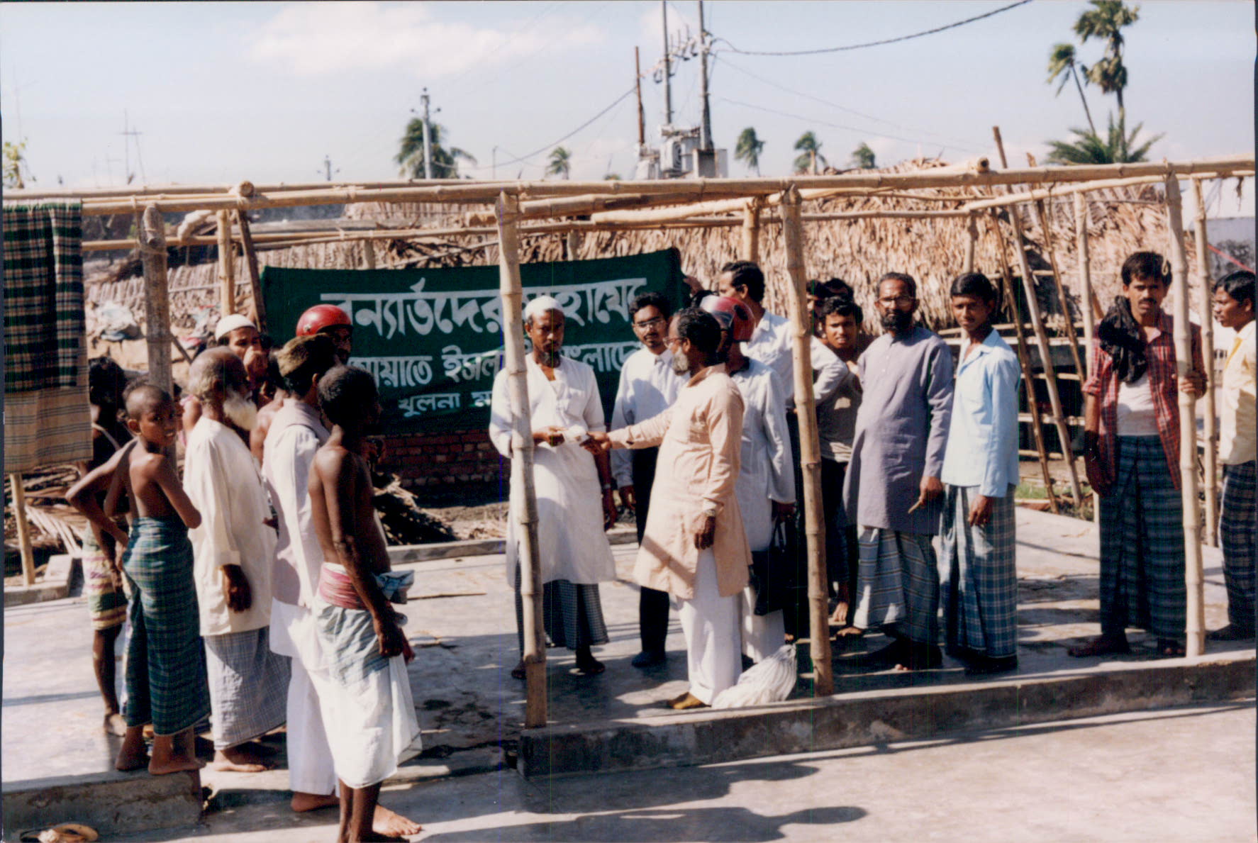 Islamic Relief delivering emergency distaster rehabilitation aid following severe flooding. Bangladesh, 1993.