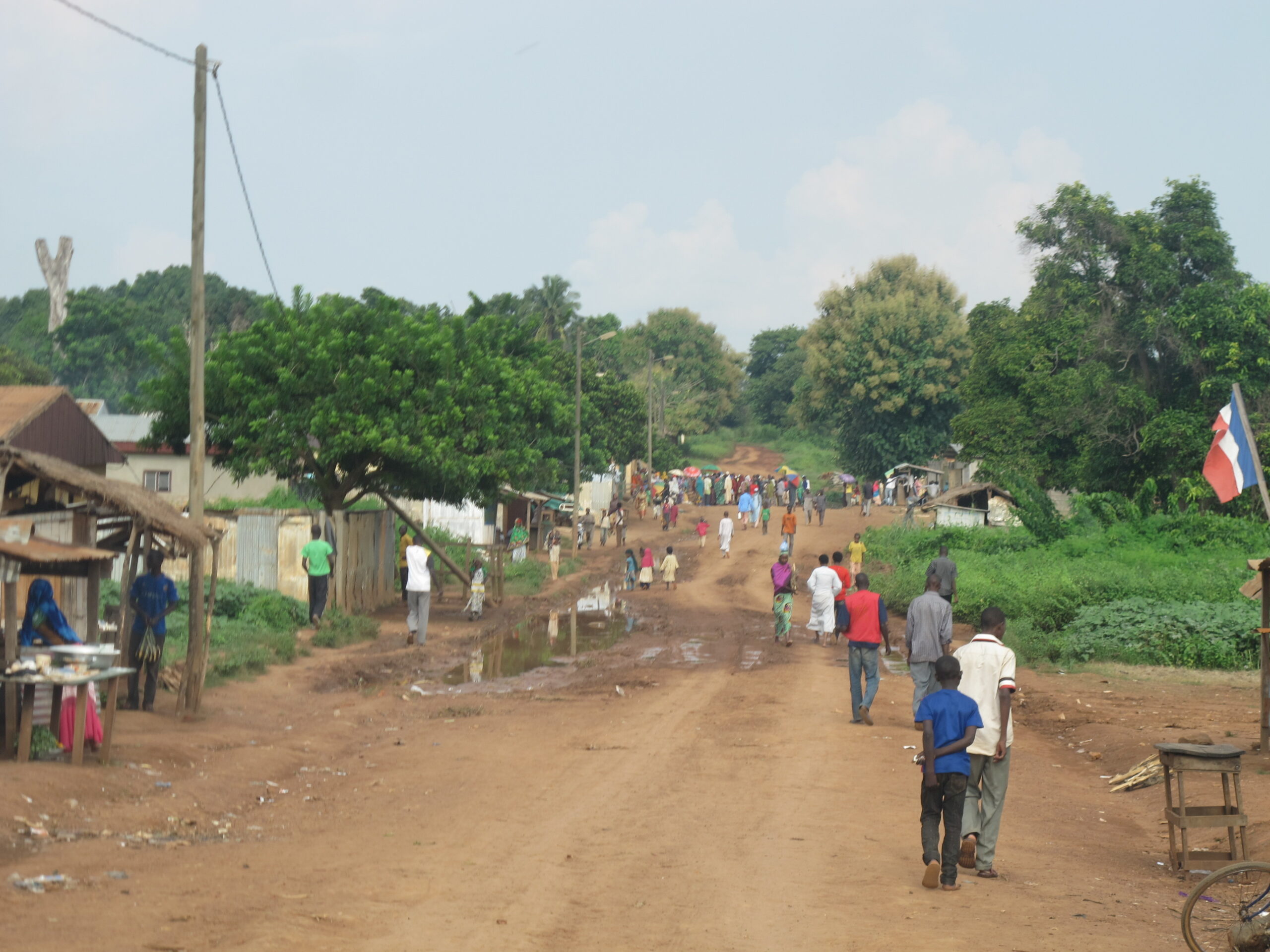 People walk to receive fresh meat from an Islamic Relief Ramadan food distribution in Boda. Central African Republic, 2014.
