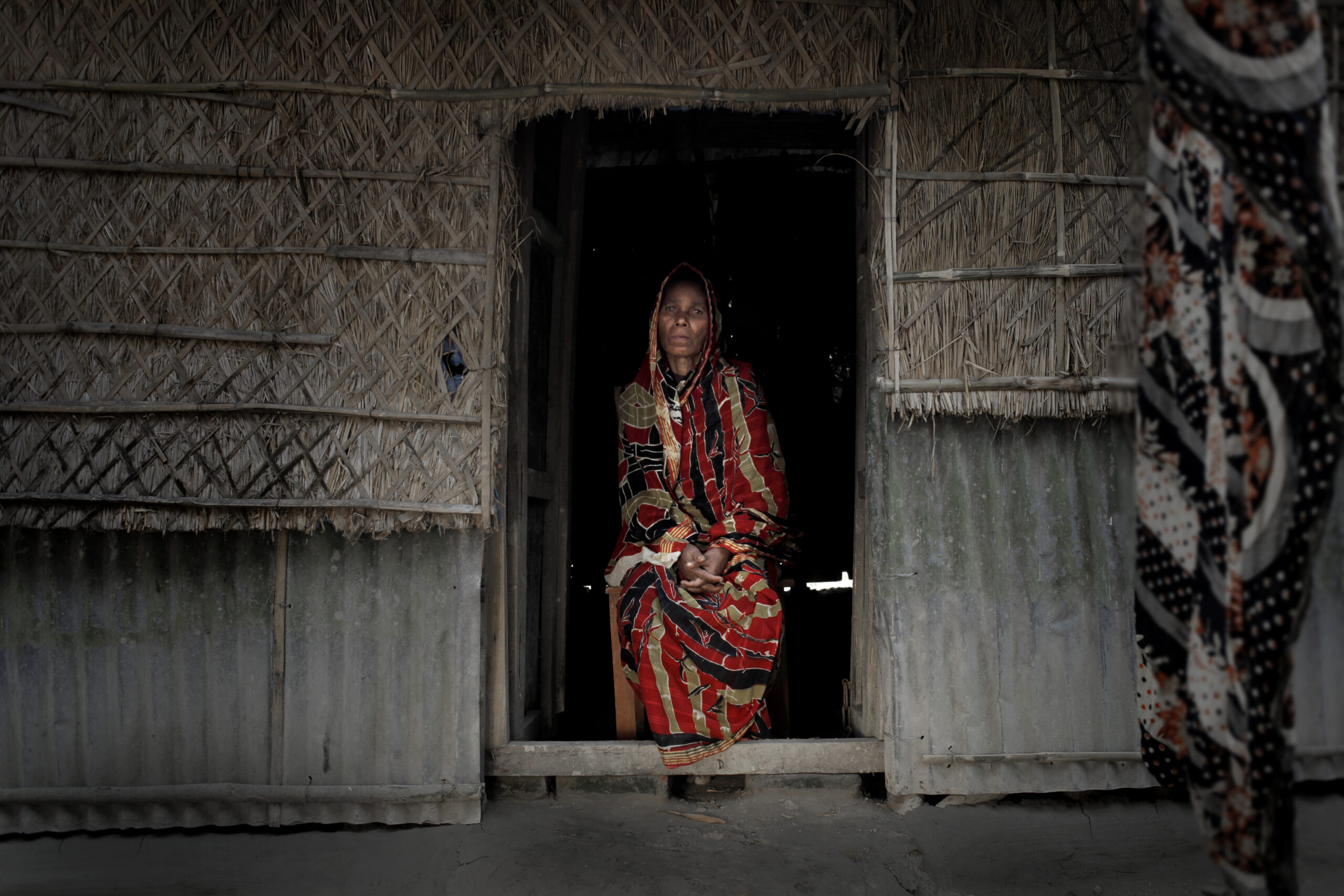 A woman is photographed inside her home following Ramadan distribution. Bangladesh, 2012.