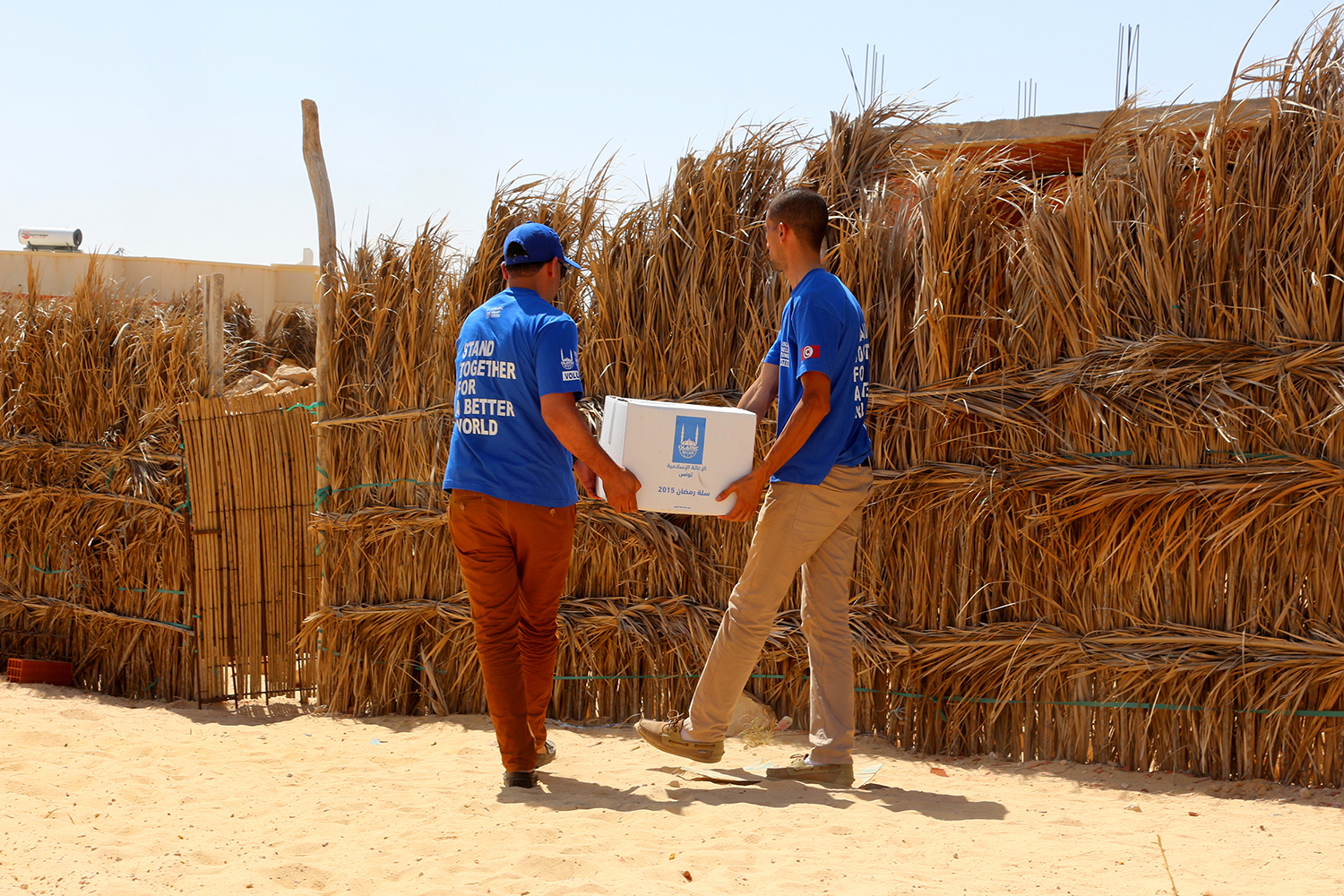 Islamic Relief staff distributing Ramadan food parcels. Tunisia, 2015.